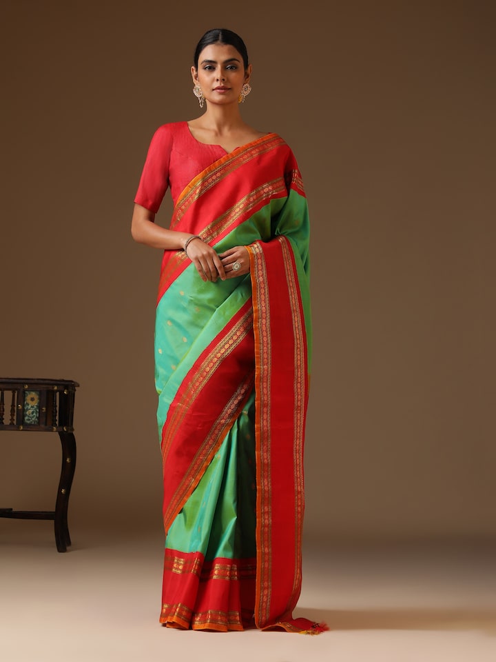 Side lifestyle image capturing the intricate zari border and weaving details.