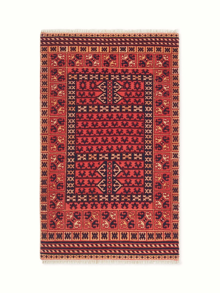 Front view displaying the full vibrant red Kazak tribal carpet, hand-knotted with Agra wool