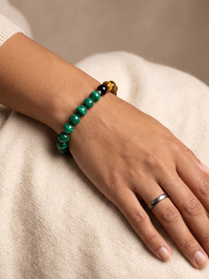 Styled view of Gemstone Tiger Eye, Black Onyx & Malachite Bead Silver Bracelet worn on the wrist, showing how it looks styled