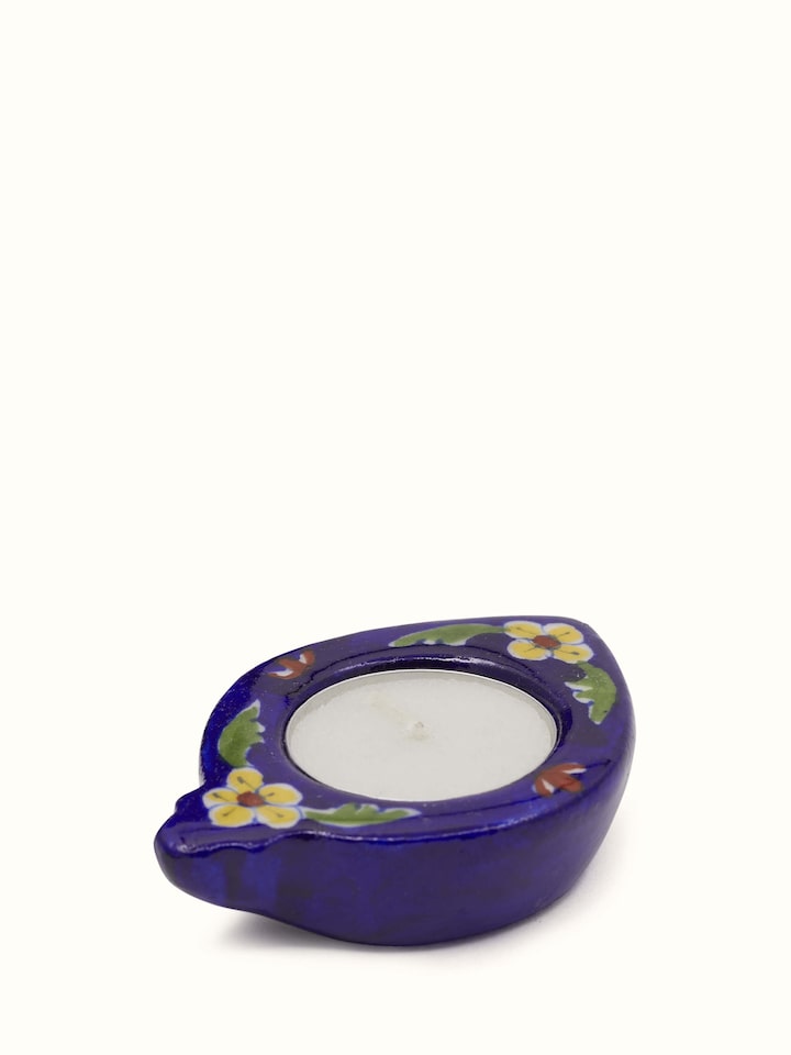 Set of blue pottery ceramic tea light holders with traditional painted design