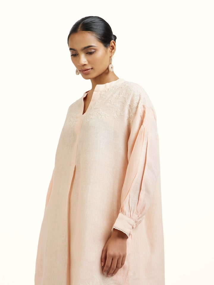 Close-up view of Peach Linen Chikankari Tunic highlighting the fabric texture and embroidery detail