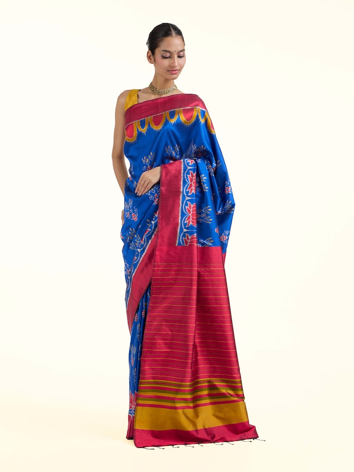Side view of blue mulberry silk bandha Odisha ikat saree highlighting graceful drape