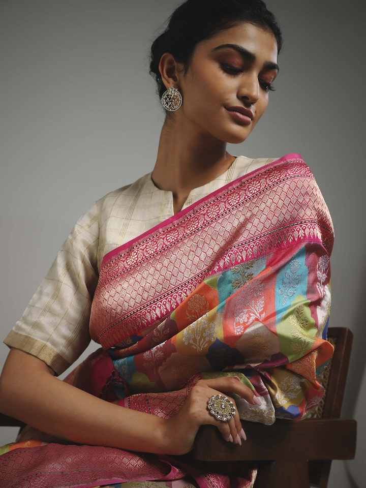 Side view of silk Banarasi saree with ornate border and motifs