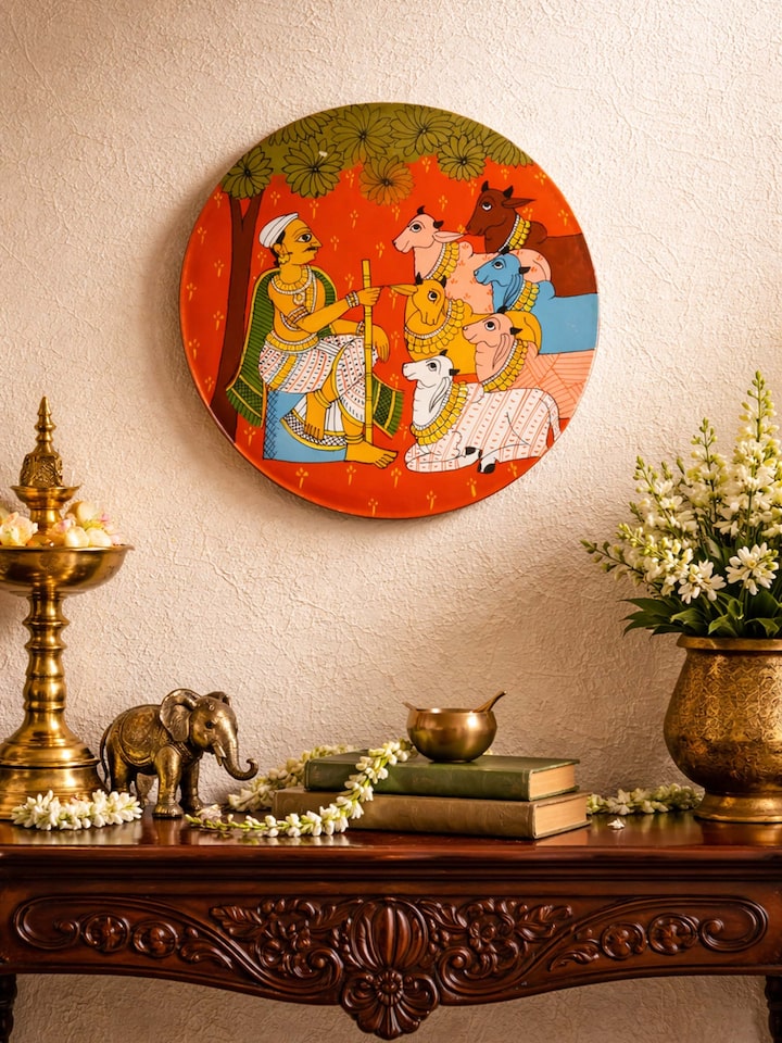 lifestyle view of cheriyal cow handpainted display plate with traditional artwork