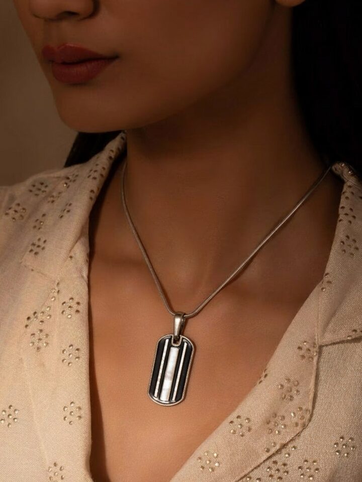 Styled view of Parchinkari Silver Pendant worn around the neck, showing how it looks styled