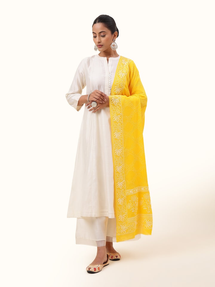 Front view of yellow georgette bandhani tie and dye dupatta with vibrant patterns