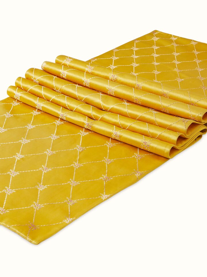Angled view of Awadh Yellow Banarasi Handloom Silk Bed Runner, highlighting its intricate Banarasi patterns.