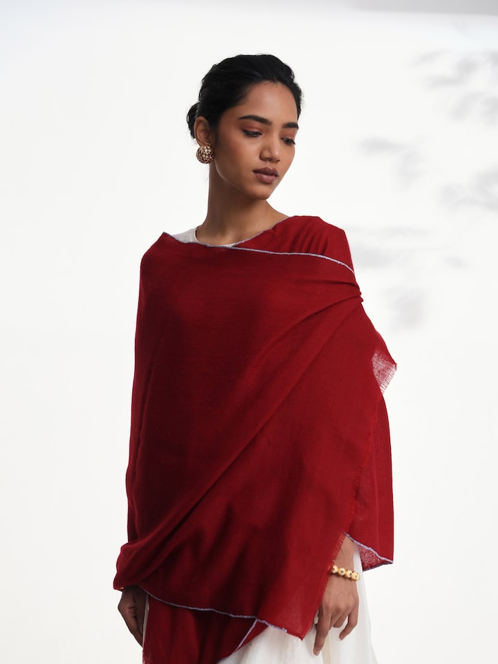 Angled view of maroon Pashmina kaaj embroidered handwoven stole emphasizing delicate kaaj work