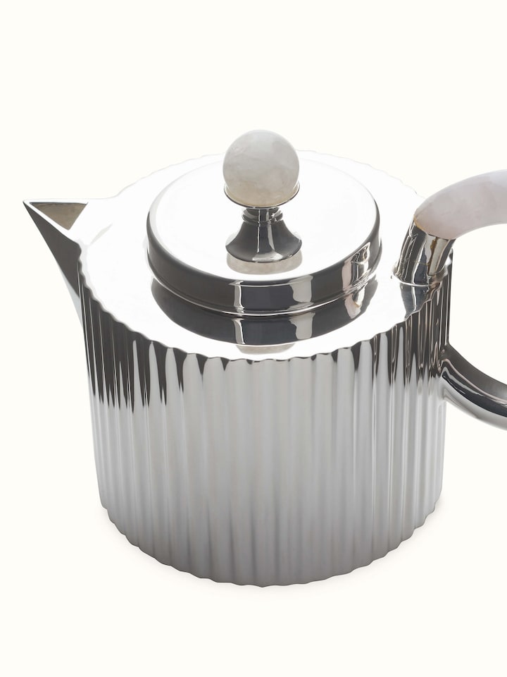 Angled view of Silver Water Reed Tea Set (3 Pcs), capturing the fine details and reflective quality of the silver water reed tea set pieces.