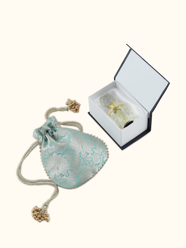 Angled view of Attar Aab (Aqua) perfume showing the transparency and shimmer of the liquid