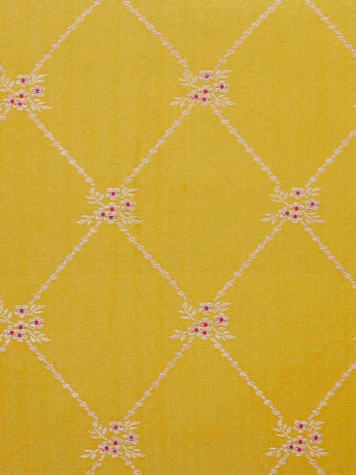 Close-up of Awadh Yellow Banarasi Cushion Cover, highlighting the intricate zari work and rich silk sheen.