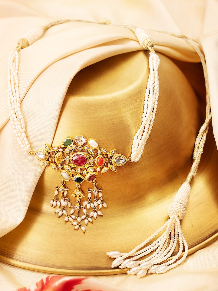 Angled view of Navratna silver choker showcasing its intricate gemstone layout and silver detailing