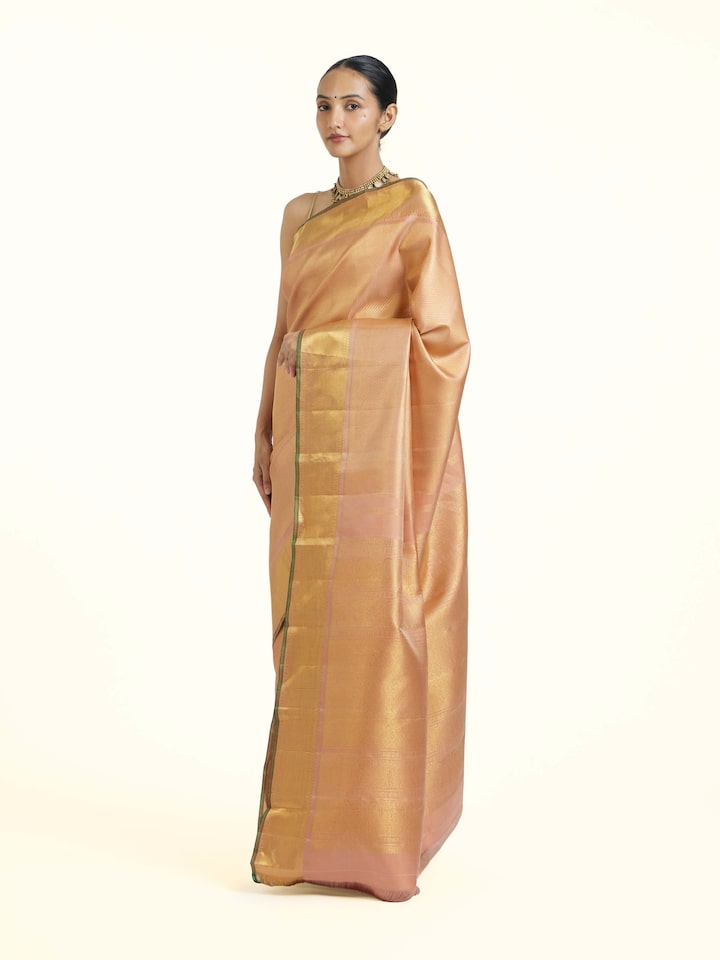 Side view of Pink Kancheepuram Silk Zari Saree highlighting the detailed craftsmanship and elegant silhouette