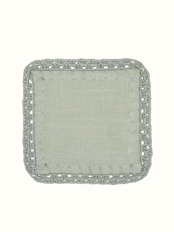 Front view of Nityam Light Green Cotton Slub Crochet Coaster showing the crochet lace edge