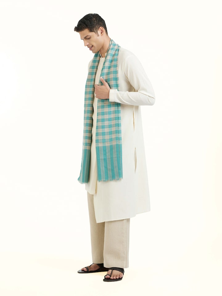 Side view of aqua cashmere stole highlighting drape and fine weave