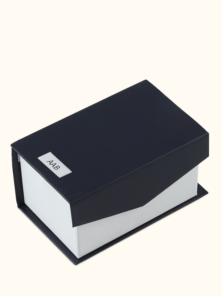 Back view of Attar Aab (Aqua) attar featuring minimal design with golden cap