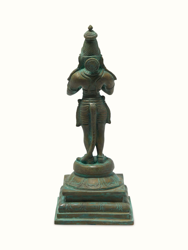 Back view of bronze Hanuman idol showing sculpted detailing