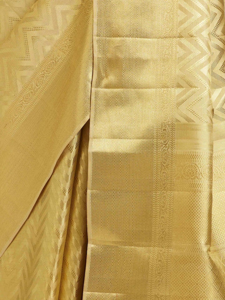Detailed view of Gold Kancheepuram Silk Zari Saree focusing on the fine craftsmanship and texture