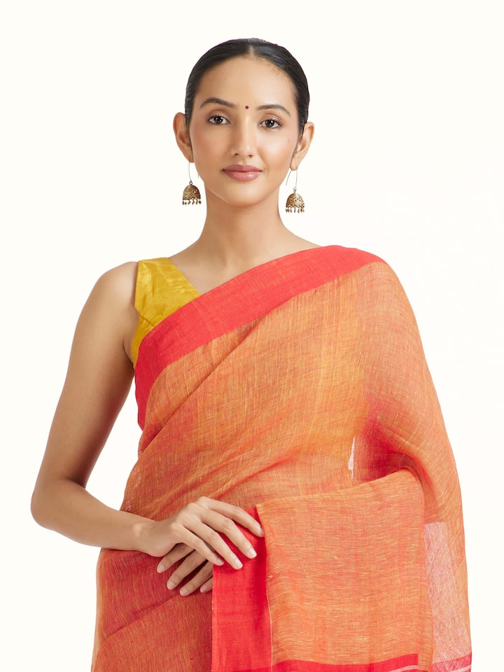 Angled view of the Orange Linen Saree