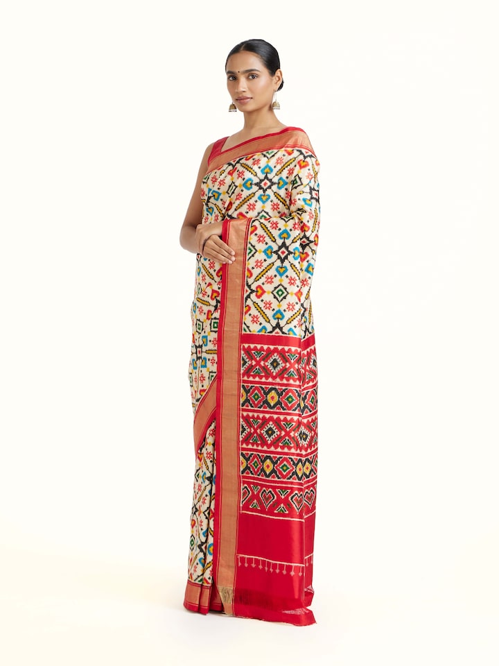 Side view of Cream Double Ikat Silk Saree highlighting the detailed craftsmanship and elegant silhouette