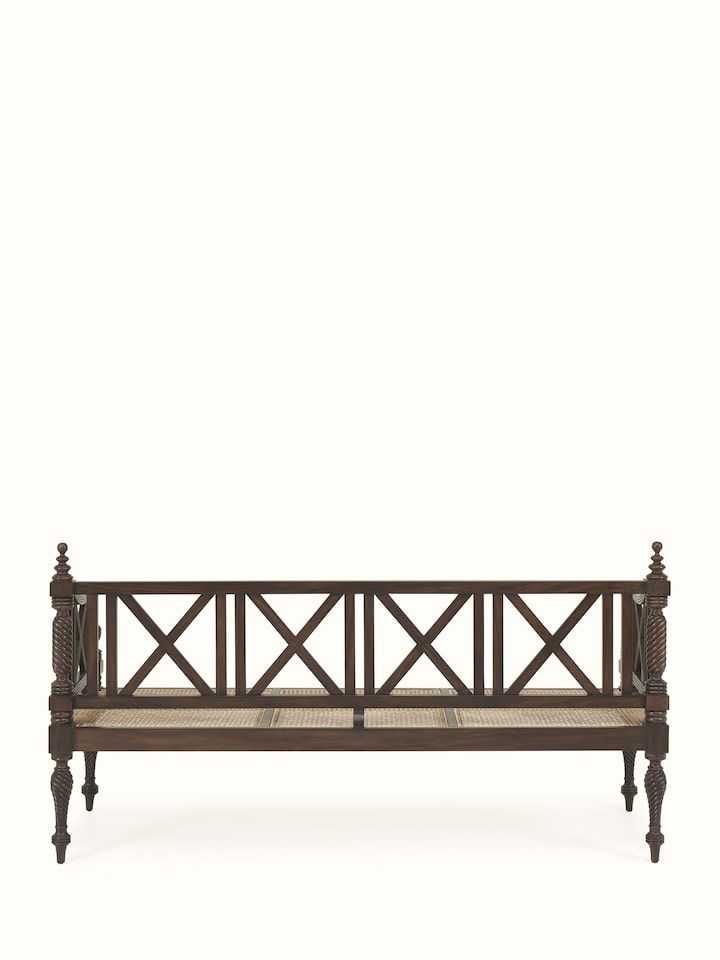 Back view of Walnut finish Mahogany wood and cane sofa showcasing structured design and polished wood back
