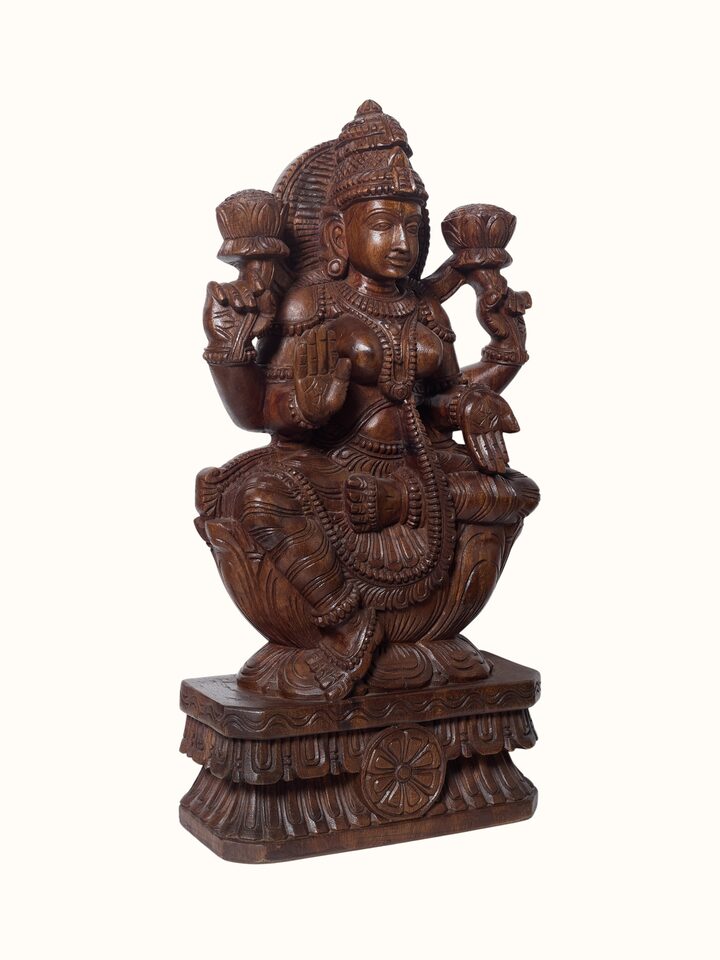 Angled view of the Wood Carved Lakshmi Devi Idol