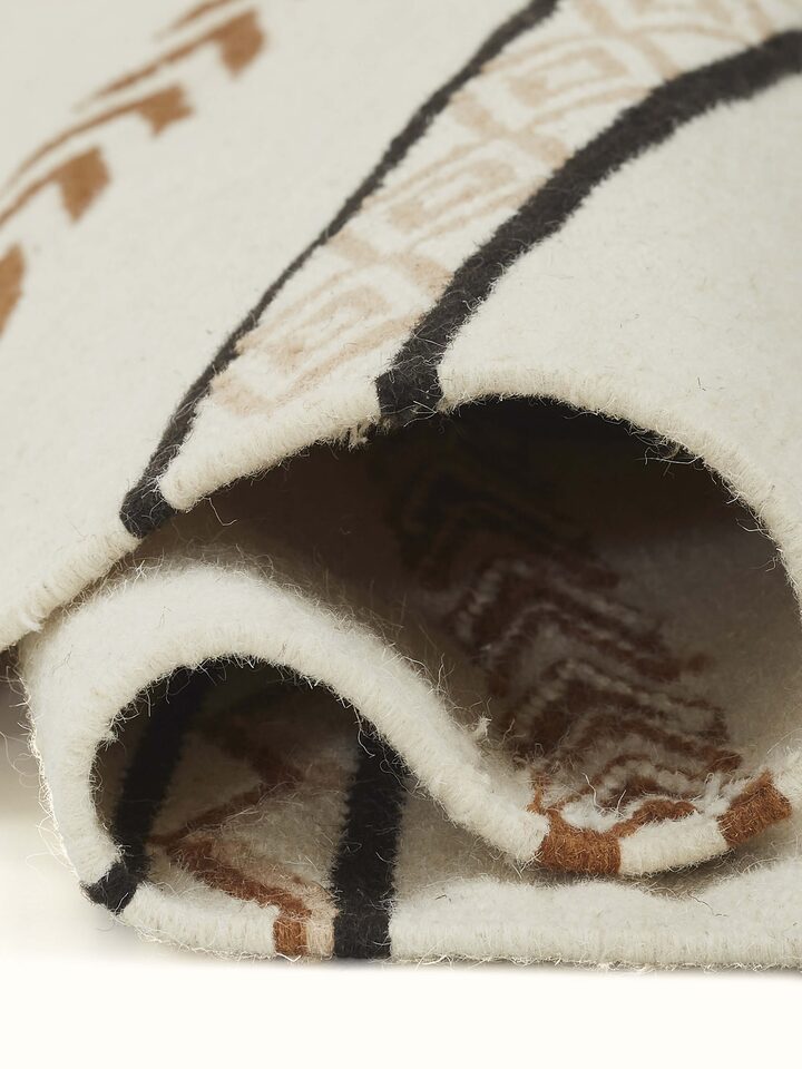 Detail shot 2: Edge detail of Panja runner revealing fine weaving and neat finish.