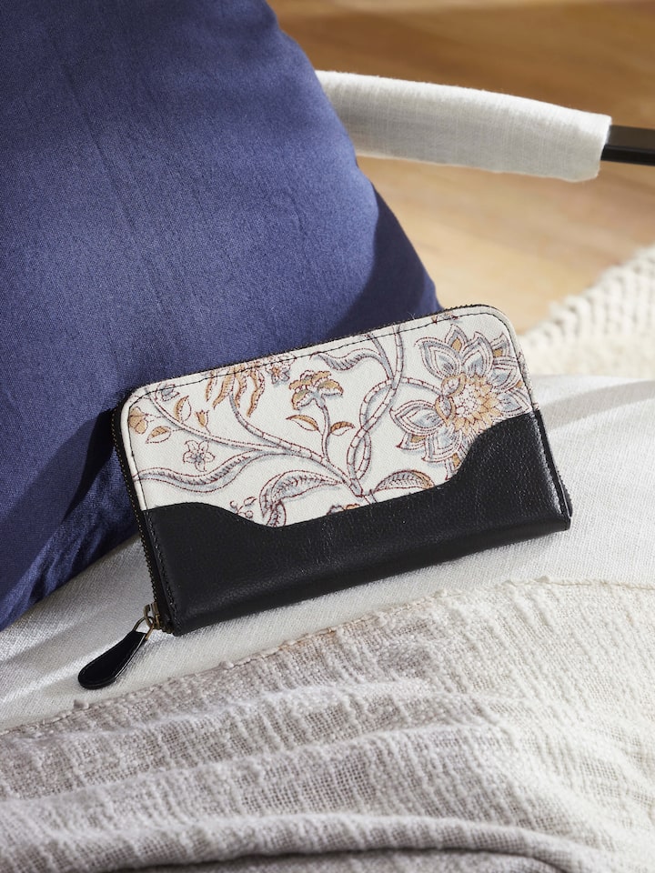 Lifestyle image showing the wallet in use, emphasizing its ethnic design.