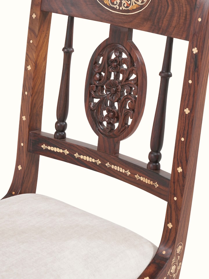 detail view of upholstered rosewood inlay dining chair upholstery