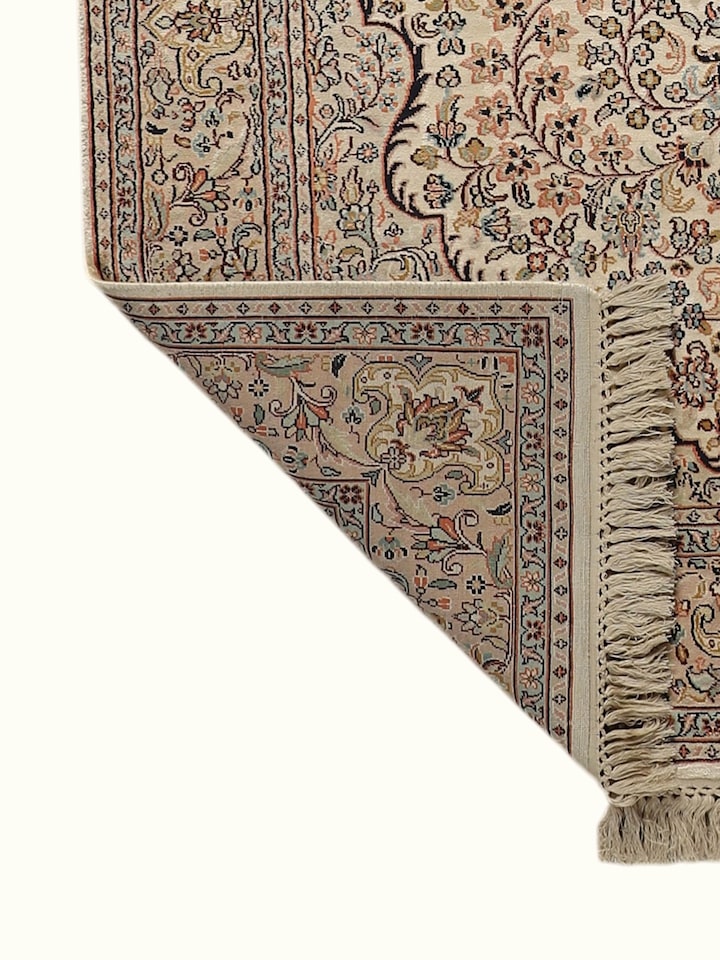 Side-angle view of the Traditional Persian Ivory Pink Kashan Kashmir Silk Hand-Knotted Carpet