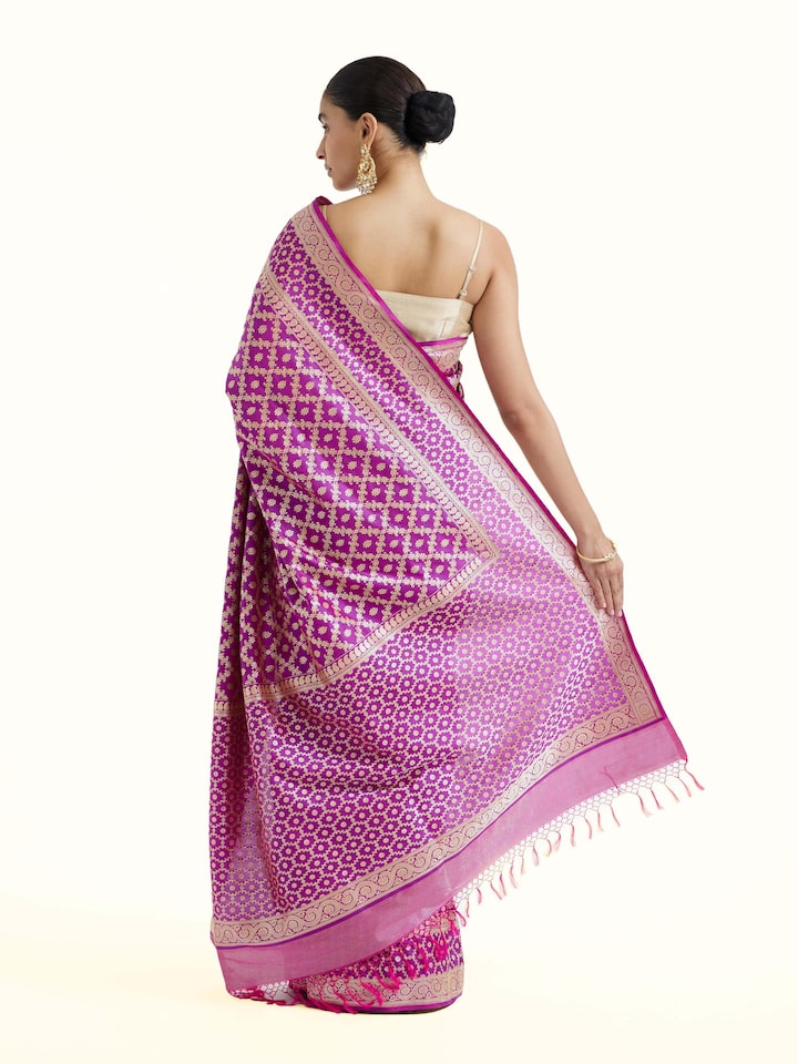 Back view of purple katan mulberry silk Banarasi saree displaying elaborate pallu