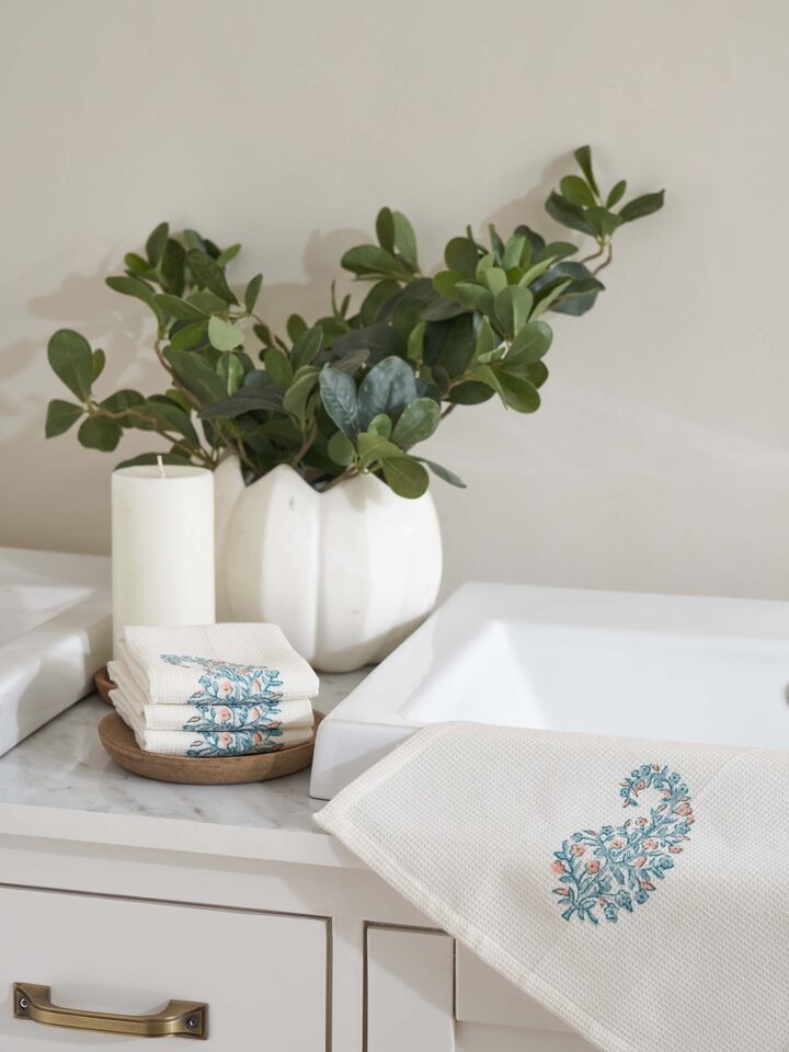 Side view of Ambi buta blue floral cotton Sanganeri block printed face towels highlighting the towel's edges and design
