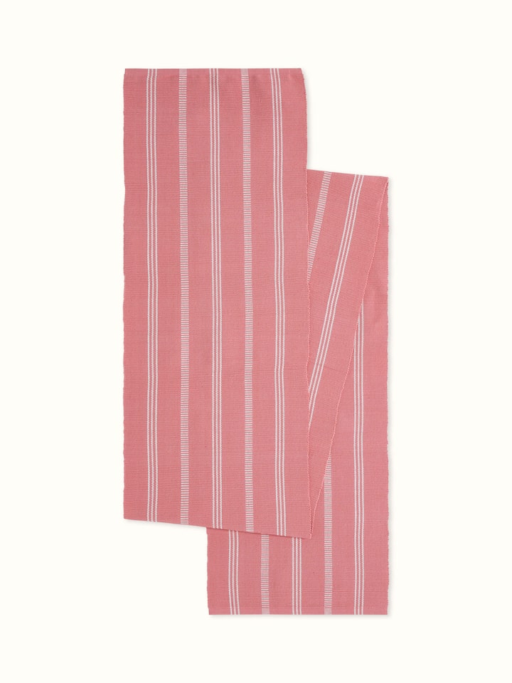 Angled close-up showcasing the soft pink stripes and handloom cotton texture