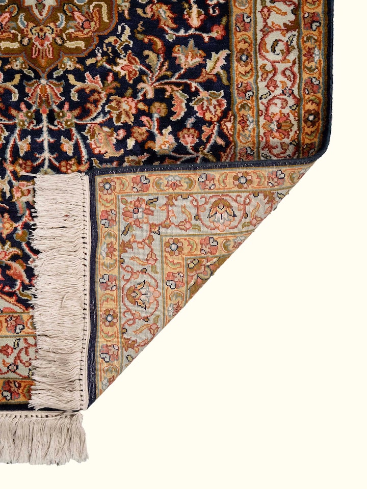 Back view of Traditional Persian Navy Green Kashan Kashmir Silk Hand-Knotted Carpet showing the reverse weave