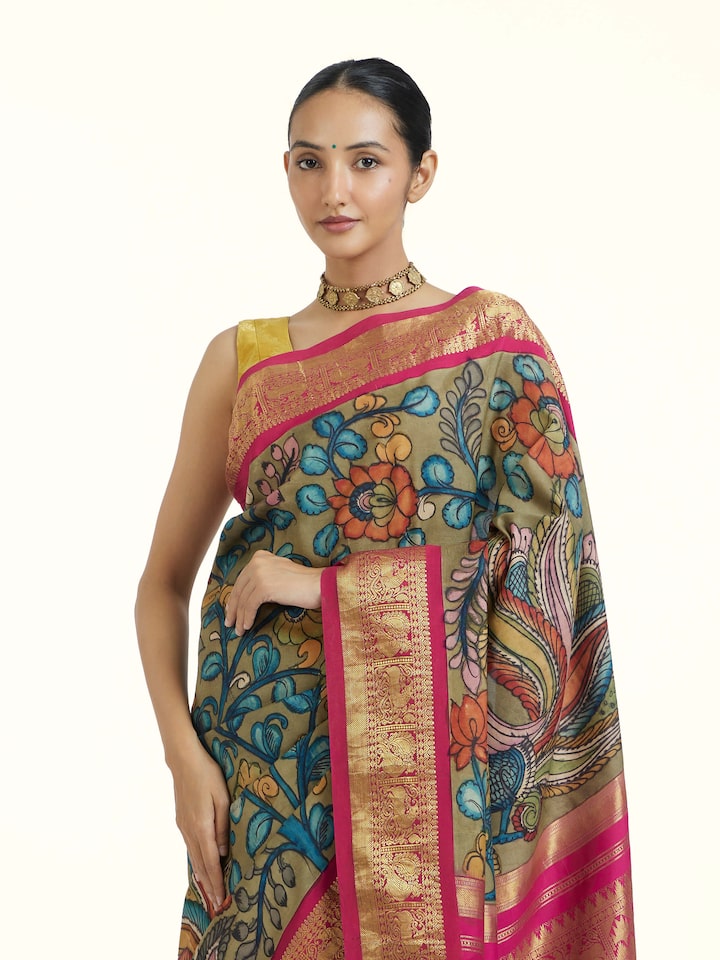 Angled view of Maroon Kalamkari Kancheepuram Saree revealing the depth of its color and intricate pattern