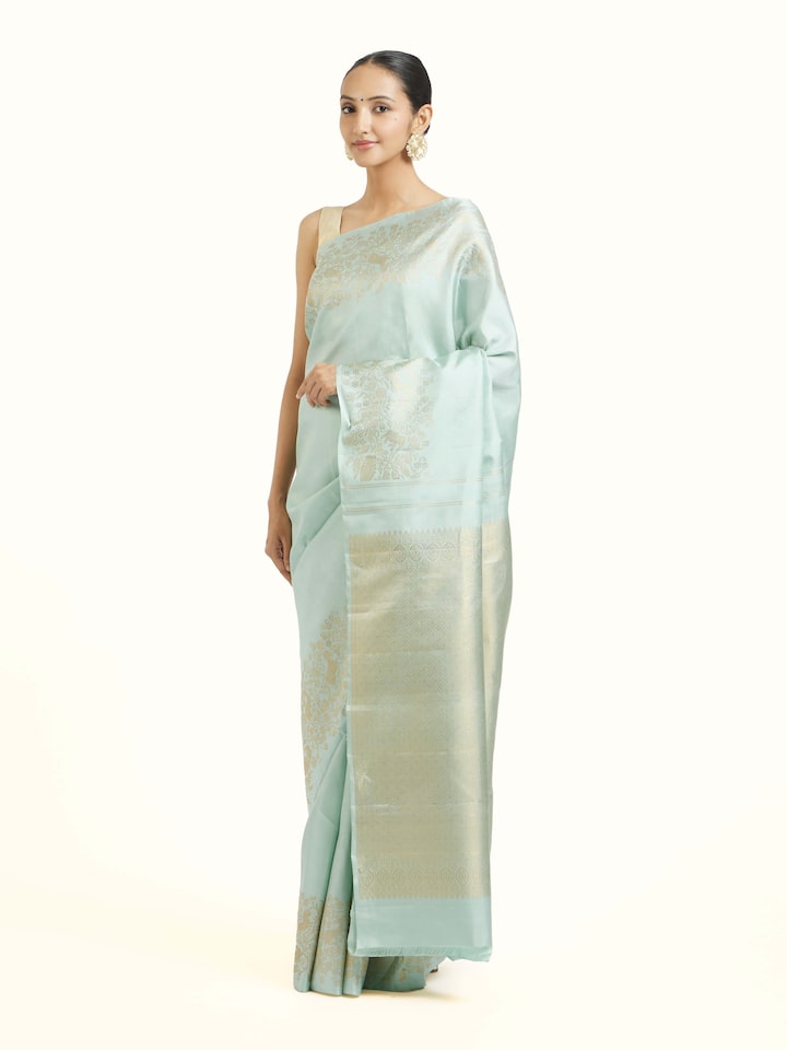 Side view of blue silk Kancheepuram saree highlighting structured drape and border