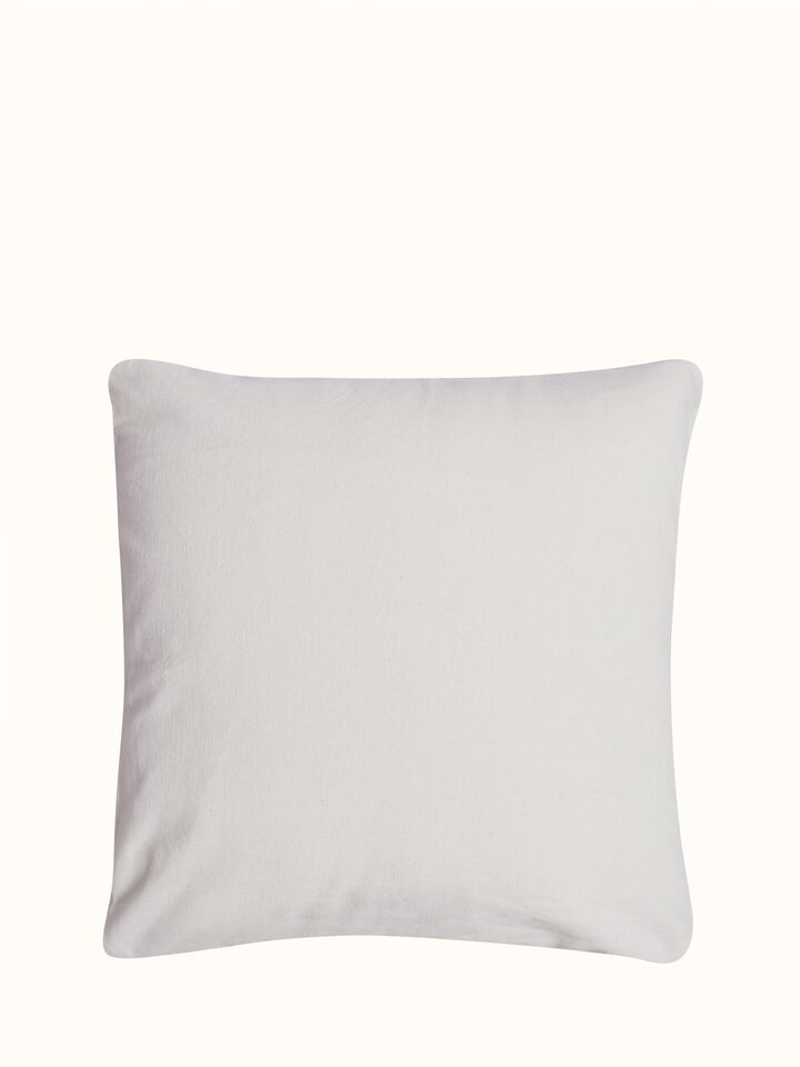 Back side view of Lippan white cotton cushion cover
