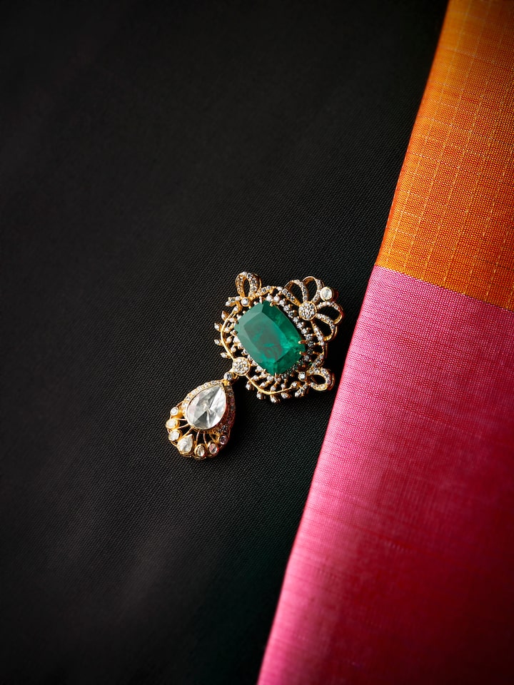 lifestyle view of silver smithing yellow gold brooch pin