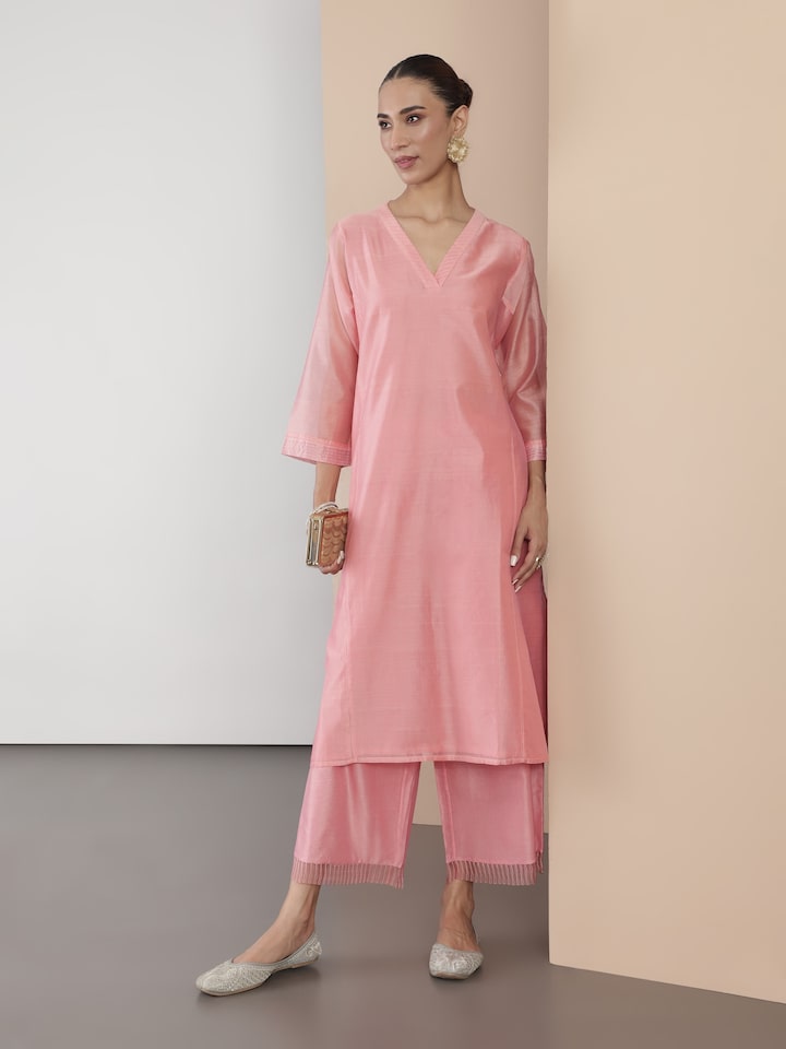 Model wearing pink Chanderi kurta in full-length side pose, showcasing its elegant drape.