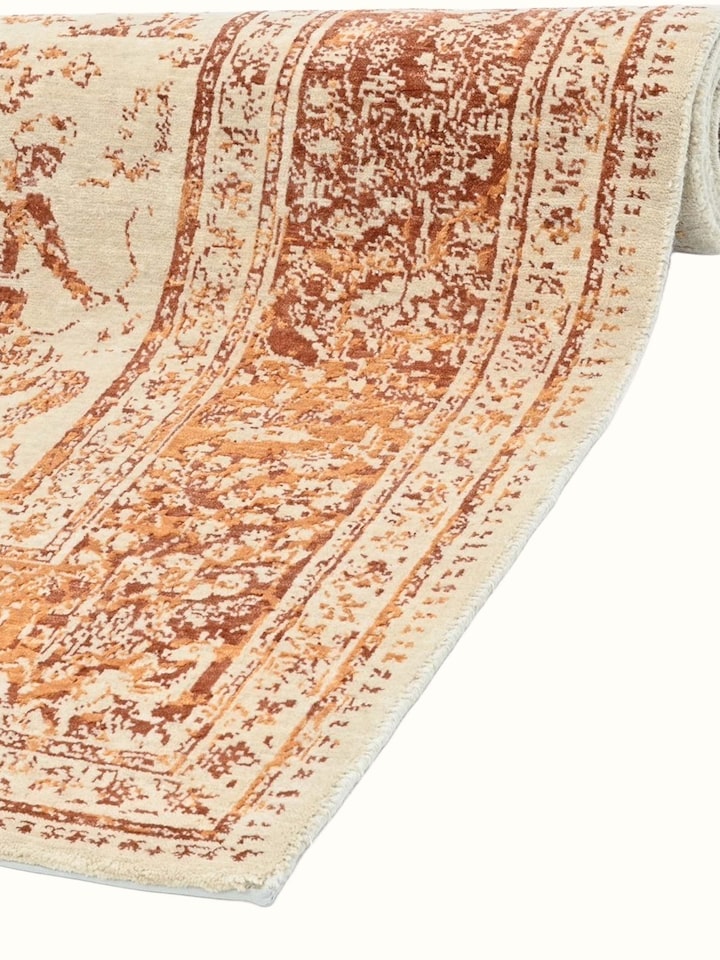 Detail view of Transitional Persian Ivory Rust Shikargah Bhadohi Wool & Bamboo Silk Hand Knotted Rug highlighting the intricate pattern and pile te...