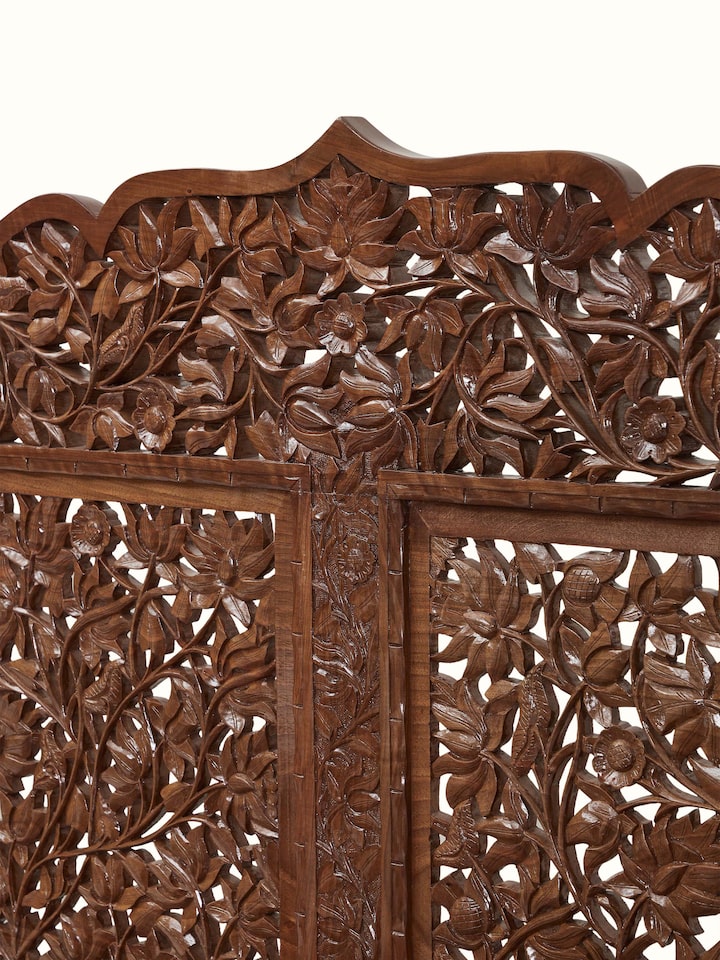 Detail view of Carved Walnut Wood Queen-size Bed highlighting the floral jali carving on the headboard