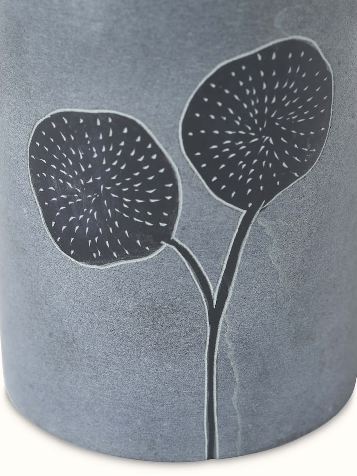 Artistic view of carved stone soap dispenser capturing the unique stone texture and detailed carving.