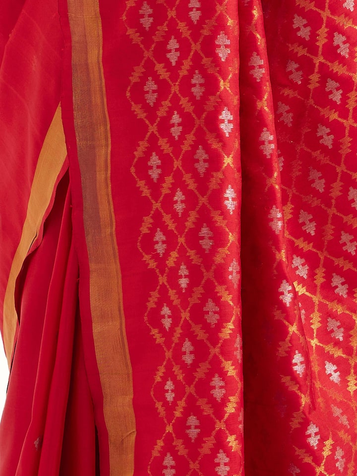 Detail view of red mulberry silk Uppada Jamdani saree showing fabric texture