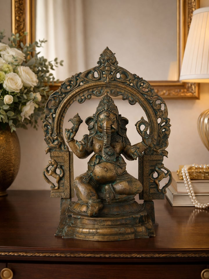 Left-side view of the Bronze Sitting Ganesha Prabhavali Idol