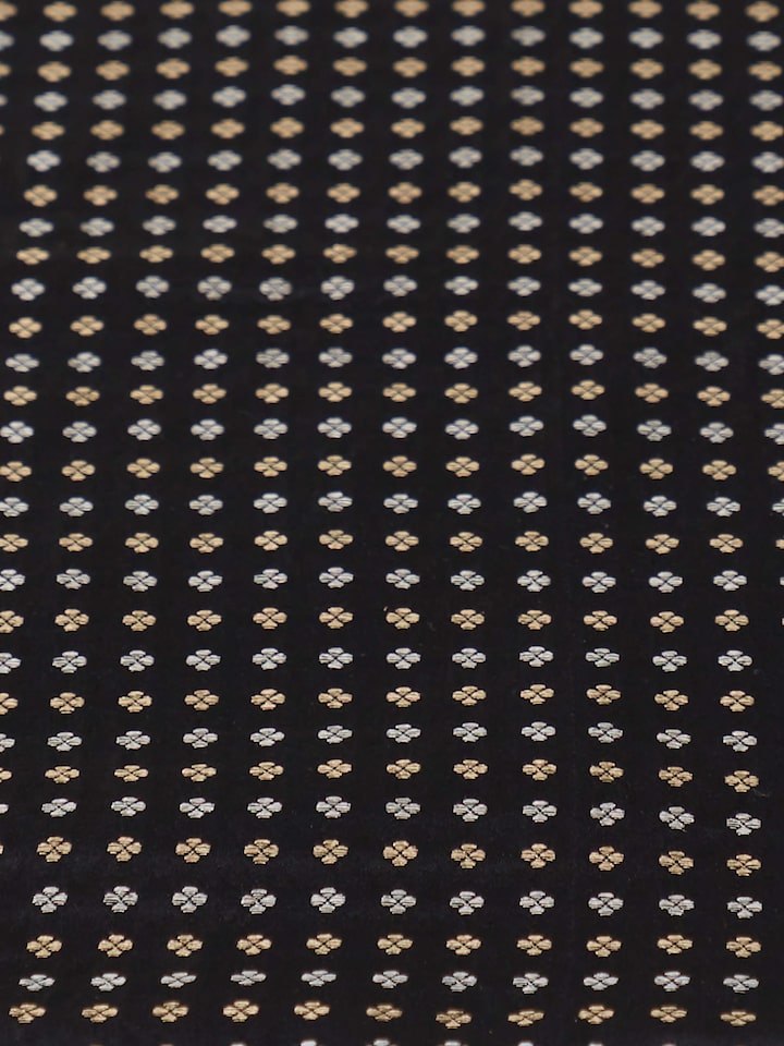 Detail shot highlighting intricate brocade weave and rich silk craftsmanship.