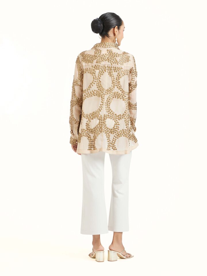 Back view of beige hand embroidered organza gold shirt displaying refined finish