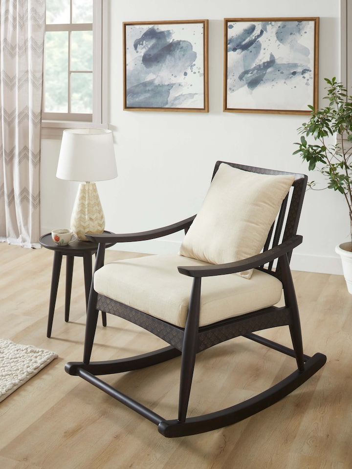 Side view of the Sheesham wood and brass tarkashi rocking chair, highlighting its elegant profile and detailed brass inlay work.
