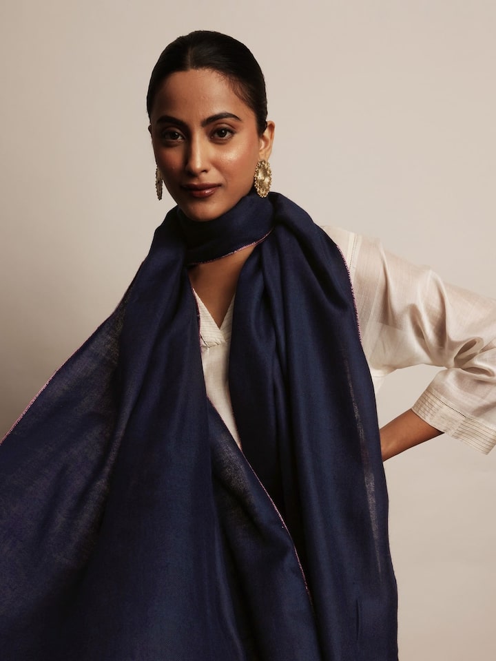 Side view of blue pashmina kaaj embroidered handwoven stole highlighting woven texture