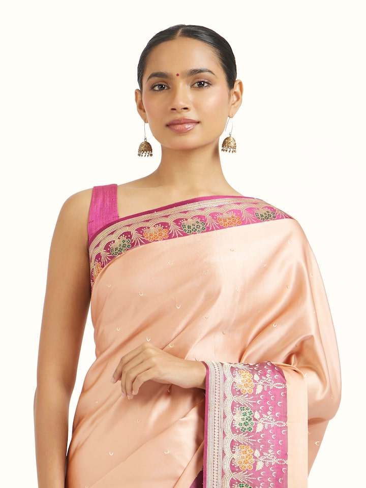 Close-up view of White Silk Banarasi Saree highlighting the handwoven motif and texture