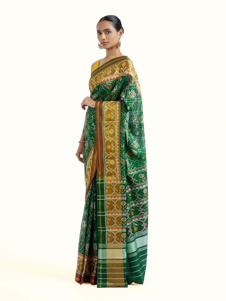 Side view of Rajkot Patola Ikat Saree highlighting the detailed craftsmanship and elegant silhouette